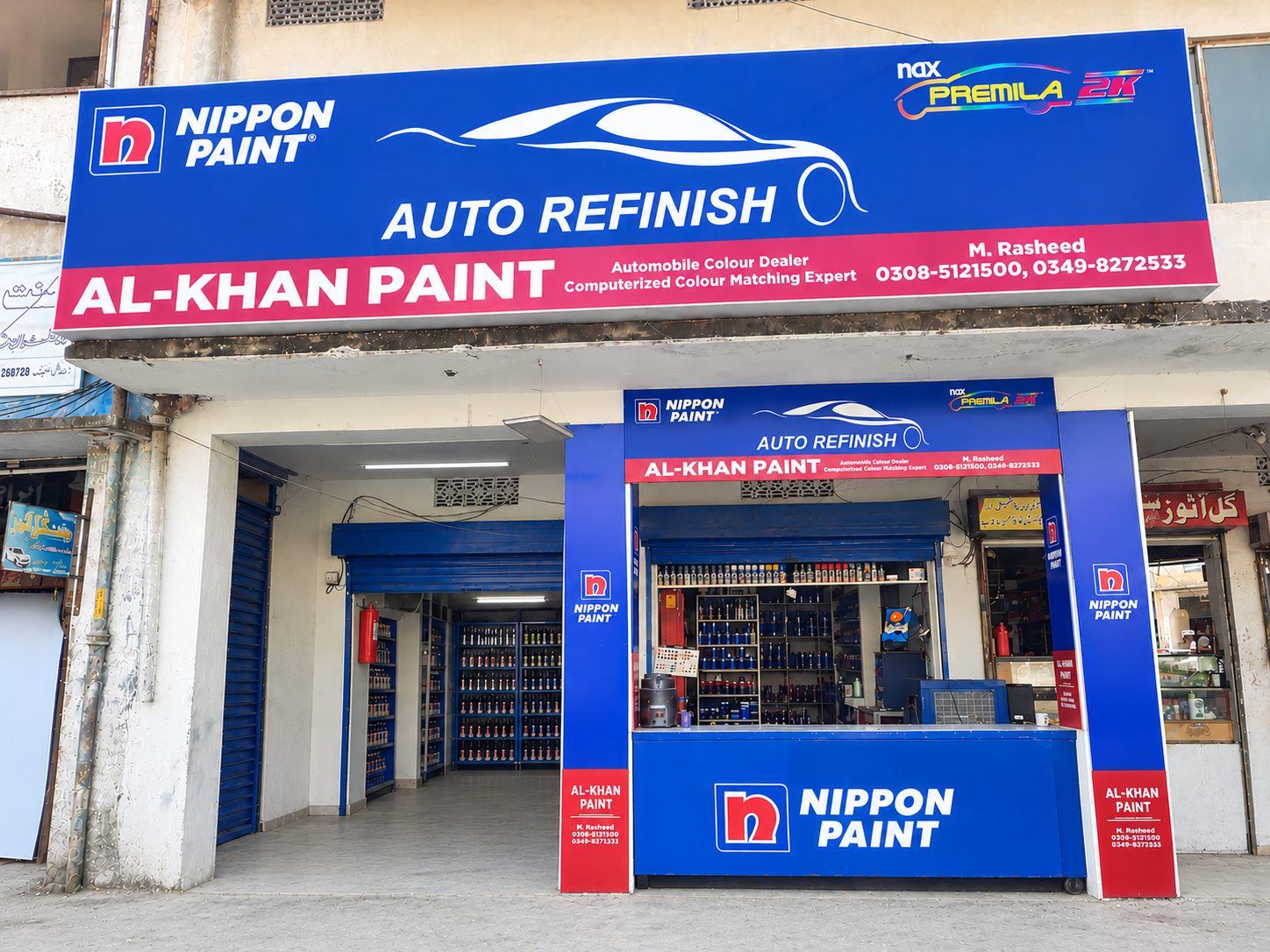 Inside AL-KHAN PAINTS at National Market, Rawalpindi — 2K paints, hardeners, clear coats, primers and paint pens arranged across the store counters